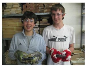 Two students with completed mitts